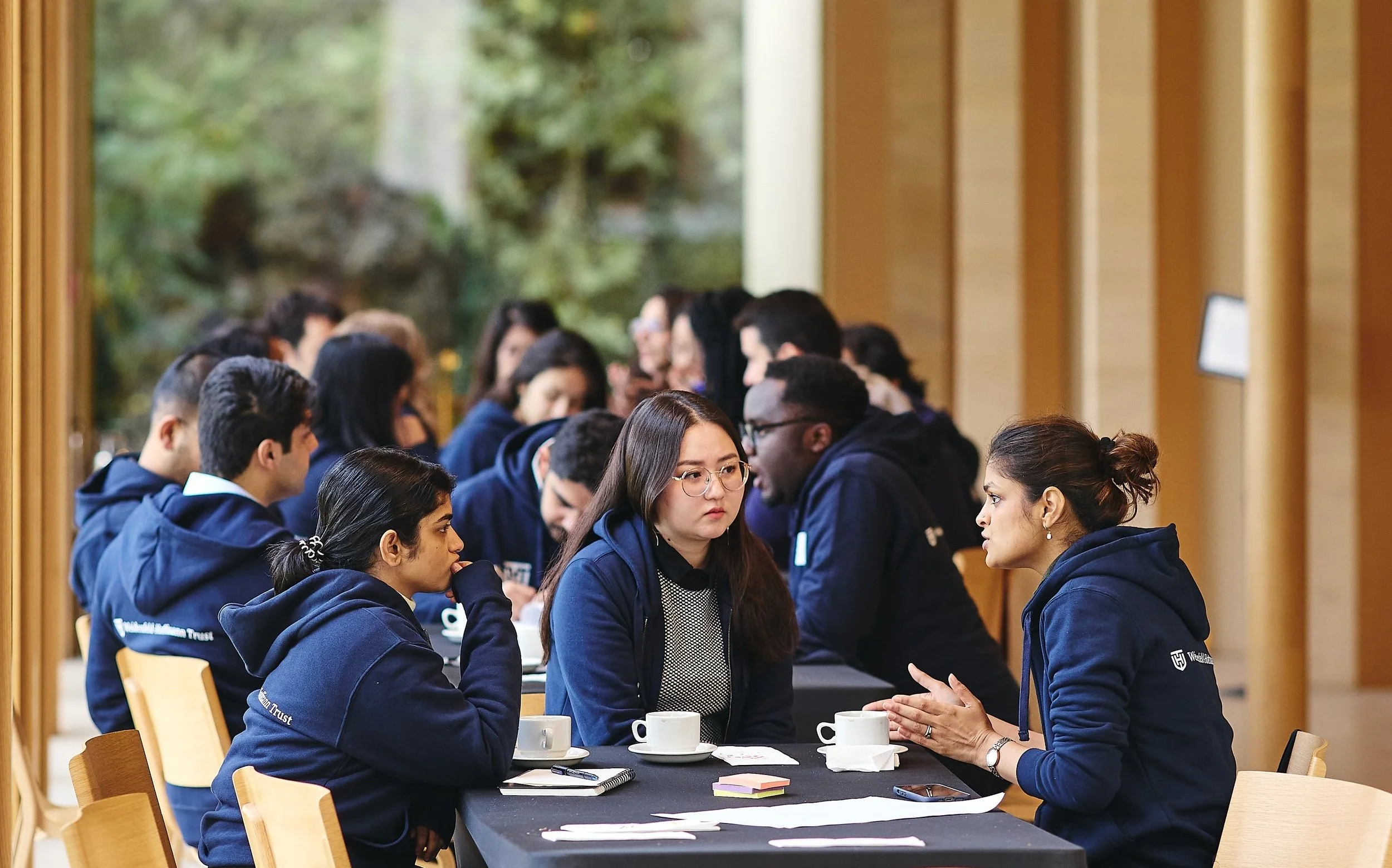 Scholars discussing their business ideas during the welcome weekend