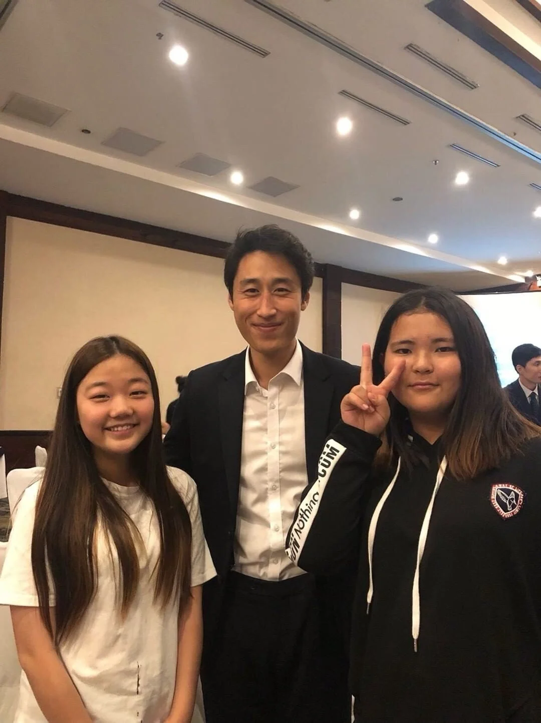  Antonio poses for a photo with young  mentees after the leadership training. 