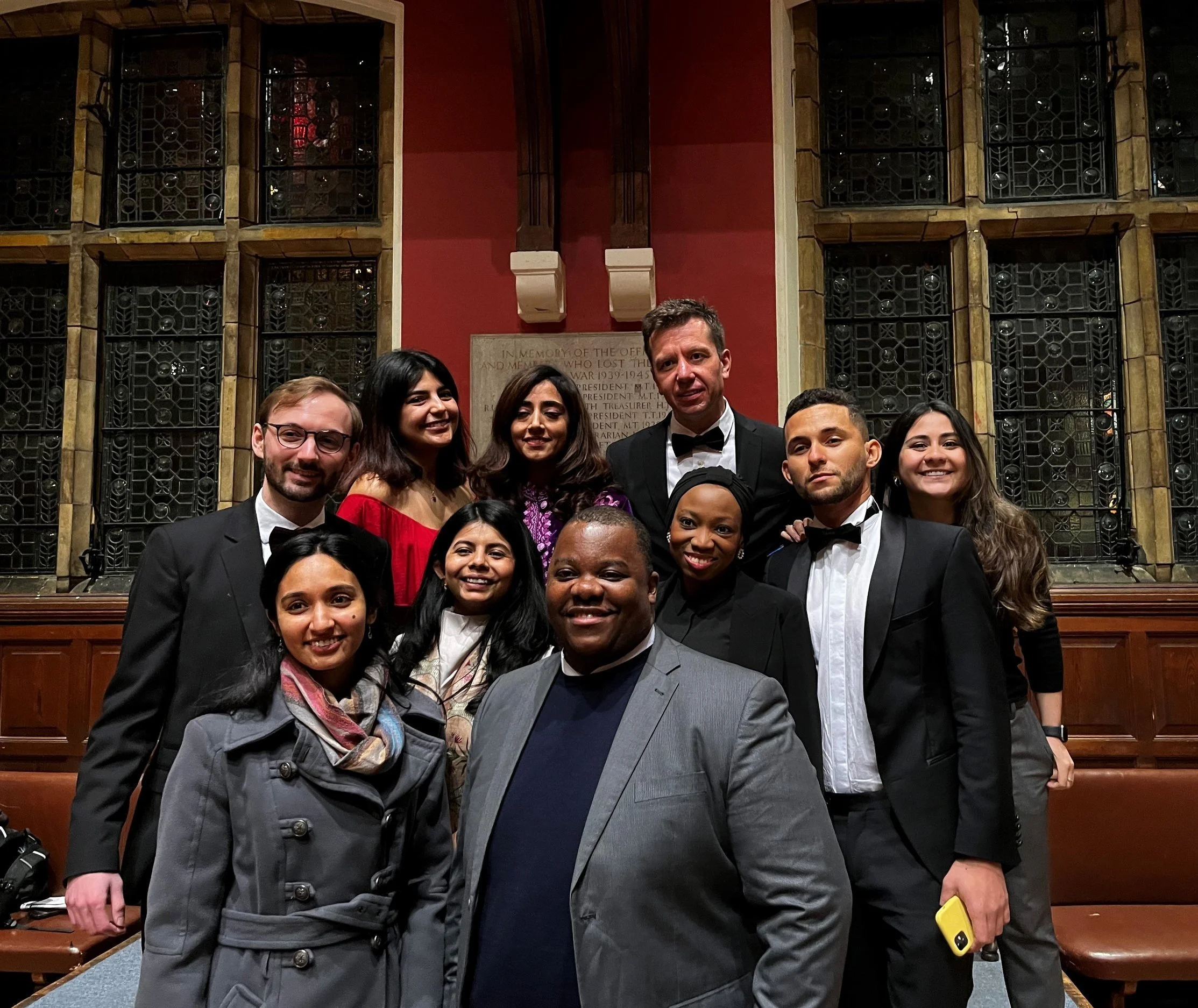  Proposition and Opposition teams with their mentors after the debate 