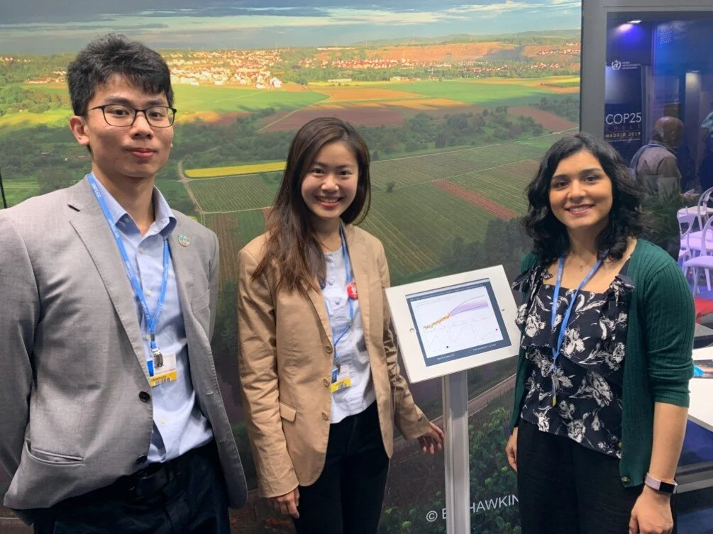 From left to right: Alvin Chan, Natalie Chung and Tania Risco present the Figure SPM.1 of SR1.5 at the IPCC Pavilion of the COP25 Chile Madrid. Spain 2019.